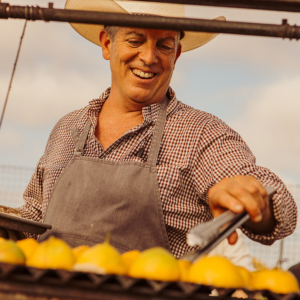 Chef David Pratt cooking farm-fresh produce for the Community Table at The Ecology Center