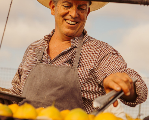 Chef David Pratt cooking farm-fresh produce for the Community Table at The Ecology Center